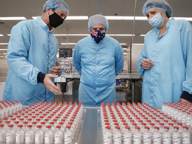 Prime Minister Scott Morrison visit to CSL serum lab to inspect COVID-19 Immunoglobulin being produced in Parkville Melbourne. The PM is shown trial vials of the AstraZeneca vaccine.   Picture: David Caird POOL IMAGES