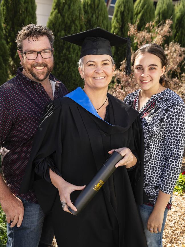 Bachelor of Nursing graduate Samantha Cochrane is congratulated by Steve Hannay and Cadence Cochrane at a UniSQ graduation ceremony at Empire Theatres, Wednesday, June 28, 2023. Picture: Kevin Farmer