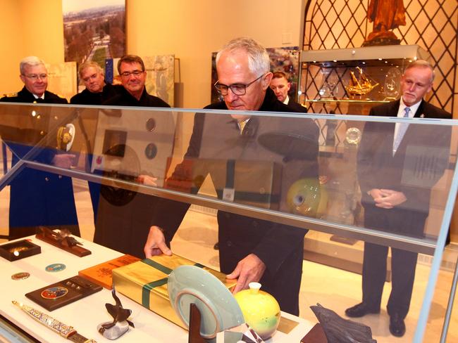 He presented an ANZAC coin collection commemorating the 100th Anniversary of ANZAC. Picture: Nathan Edwards