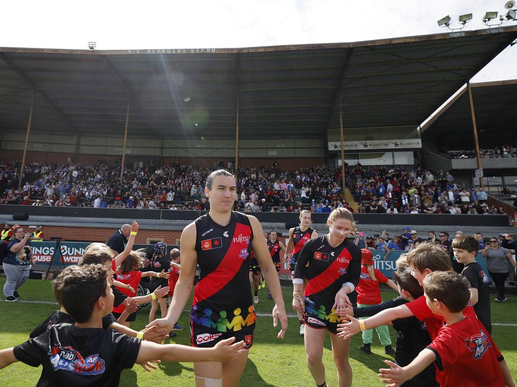 Bonnie Toogood and Georgia Nanscawen lead Essendon out on Sunday. Picture: Michael Klein