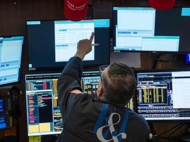 Traders work the floor of the New York Stock Exchange on August 16, 2024. US stocks edged lower in early trading Friday, as traders looked to lock in gains at the end of a positive week for major Wall Street indices. Around 10 minutes into trading, the Dow Jones Industrial Average was down 0.1 percent at 40,518.87, and the S&P was 0.1 percent lower at 5,536.08. The Nasdaq slipped 0.2 percent to 17,566.08. (Photo by ANGELA WEISS / AFP)