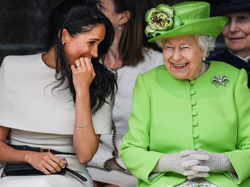 2018: Queen Elizabeth II sits and laughs with Meghan, Duchess of Sussex during a ceremony to open the new Mersey Gateway Bridge on June 14, 2018. Picture: Jeff J Mitchell/Getty Images