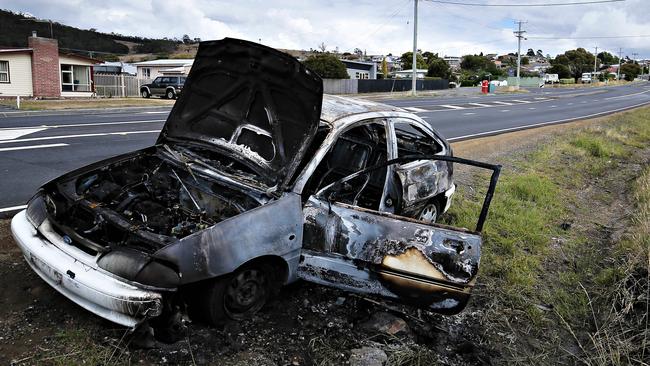 A burnt out car on South Arm Highway, Clarendon Vale. Picture: RICHARD JUPE