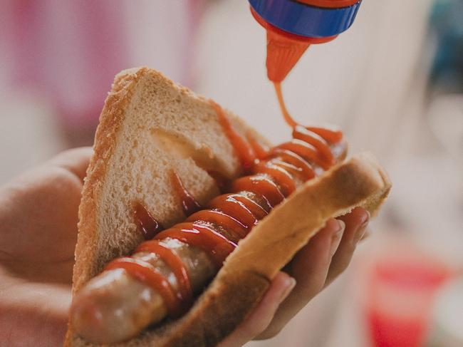 Close up shot of a sausage in a piece of bread, know as 'sausage sizzle' by the Australian community.  Picture: istock