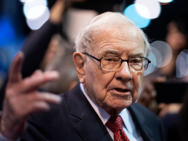 (FILES) In this file photo taken on May 04, 2019, Warren Buffett, CEO of Berkshire Hathaway, speaks to the press as he arrives at the 2019 annual shareholders meeting in Omaha, Nebraska. - Berkshire Hathaway, the holding company of Warren Buffett, bought back approximately $5.1 billion of its own shares in the second quarter as it was hit hard by economic fallout from the coronavirus pandemic. Berkshire's net profit climbed to $26.3 billion, up sharply from $14.1 billion in the same period last year. (Photo by Johannes EISELE / AFP)