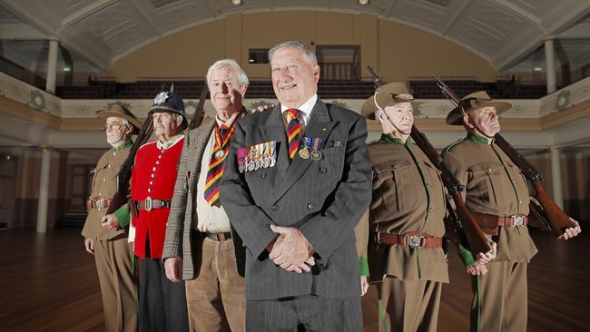 Historian Reg Watson with Tony Bisdee, descendant of Victoria Cross recipient John Hutton Bisdee, centre, and members of Military Collectors of Tasmania, back from left, John Presser, Derrick Millhouse, John Wise and Kevin Daley. Picture: PATRICK GEE