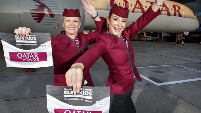 17/03/2021 Qatar ground staff Alida DiGiantomasso and Ruby El Haji with their Run for the kids bibs at Melbourne airport with a Qatar airways plane. Qatar is to announce support of the Good Friday Appeal and provision of the major prize for Virtual R4K.Picture David Geraghty