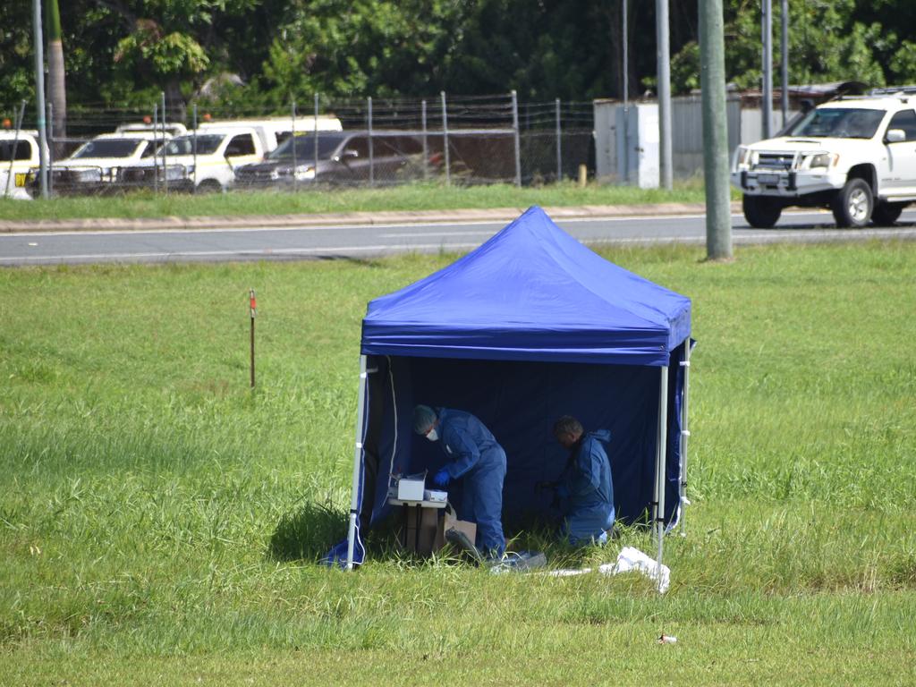 Police in a vacant area off the Bruce Highway at Paget, near The Park caravan park, where the body of 25-year-old Mr Fa’apepele was found in the early hours. Picture: Matthew Forrest