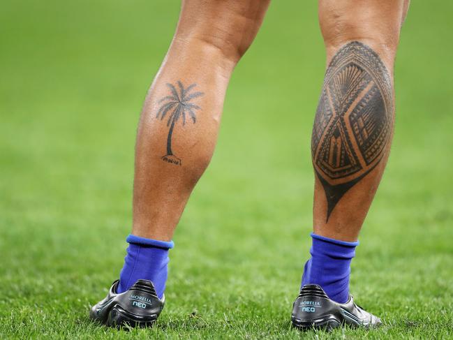 The tattooed legs of Ed Fidow of Samoa.