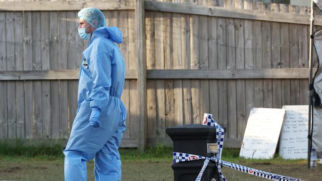 Forensic police investigate. Picture: Liam Kidston