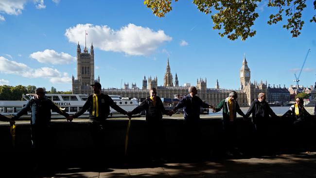 Supporters of WikiLeaks founder Julian Assange form a human chain around the Houses of Parliament, in London. Picture: AFP