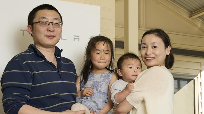 Lingwen Kong with his family, Olivia Kong, 3, Oscar Kong, 8 months, and Joy Kong at home in Fullarton, with their BYD Atto 3, solar and battery, Sunday, Sept. 10, 2023. Picture: Matt Loxton