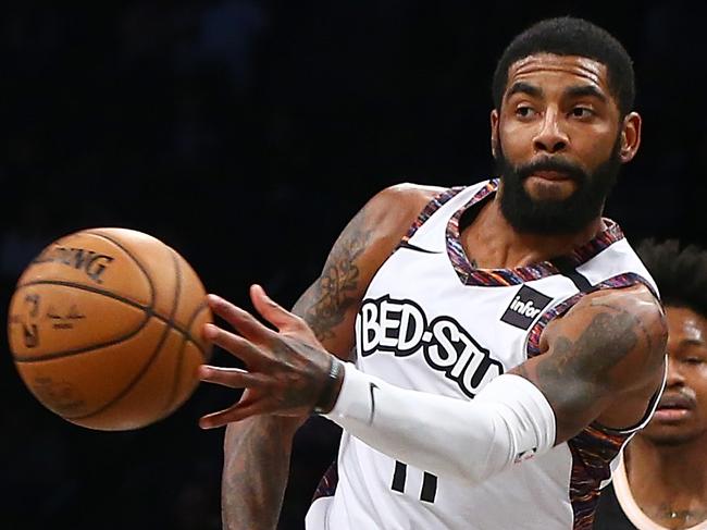 NEW YORK, NEW YORK - JANUARY 12:  Kyrie Irving #11 of the Brooklyn Nets passes the ball against the Atlanta Hawks at Barclays Center on January 12, 2020 in New York City. NOTE TO USER: User expressly acknowledges and agrees that, by downloading and or using this photograph, User is consenting to the terms and conditions of the Getty Images License Agreement. Mandatory Copyright Notice: Copyright 2020 NBAE.  (Photo by Mike Stobe/Getty Images)
