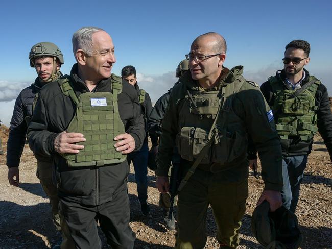 Israeli Prime Minister Benjamin Netanyahu walking with members of the Israeli army at Mount Hermon in the annexed Golan Heights. Picture: AFP