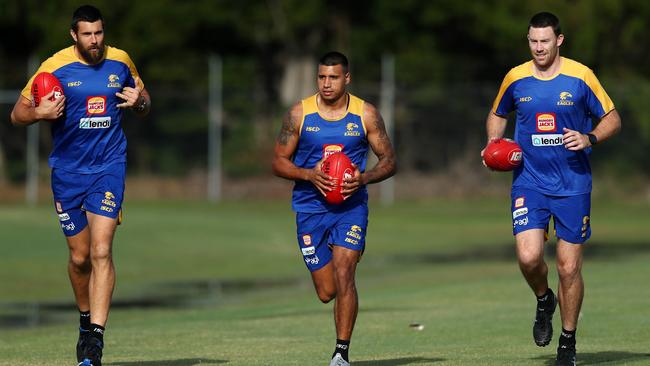 West Coast’s Josh Kennedy, Tim Kelly and Jeremy McGovern train on the Gold Coast. Picture: Getty Images