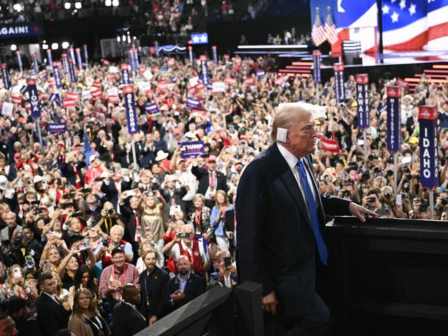 TOPSHOT - US former President and 2024 Republican presidential candidate Donald Trump attends the second day of the 2024 Republican National Convention at the Fiserv Forum in Milwaukee, Wisconsin, July 16, 2024. Days after he survived an assassination attempt Donald Trump won formal nomination as the Republican presidential candidate and picked right-wing loyalist J.D. Vance for running mate, kicking off a triumphalist party convention in the wake of last weekend's failed assassination attempt. (Photo by Brendan SMIALOWSKI / AFP)