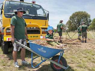 Shane Gannon and his son Chaise get their hands dirty at a Prenzlau fire brigade open day on Monday. . Picture: Contributed