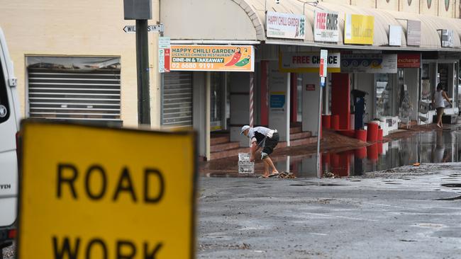 Cleaning after flood water hit Byron Bay.