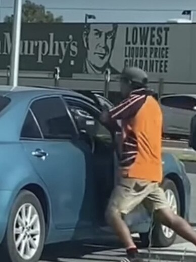 A man is seen pushing the driver’s door shut.