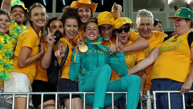 Alicia Quirk celebrates with fans and her gold medal. Picture: Adam Head