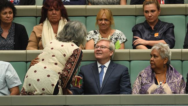 Former prime minister Kevin Rudd is greeted in parliament yesterday.