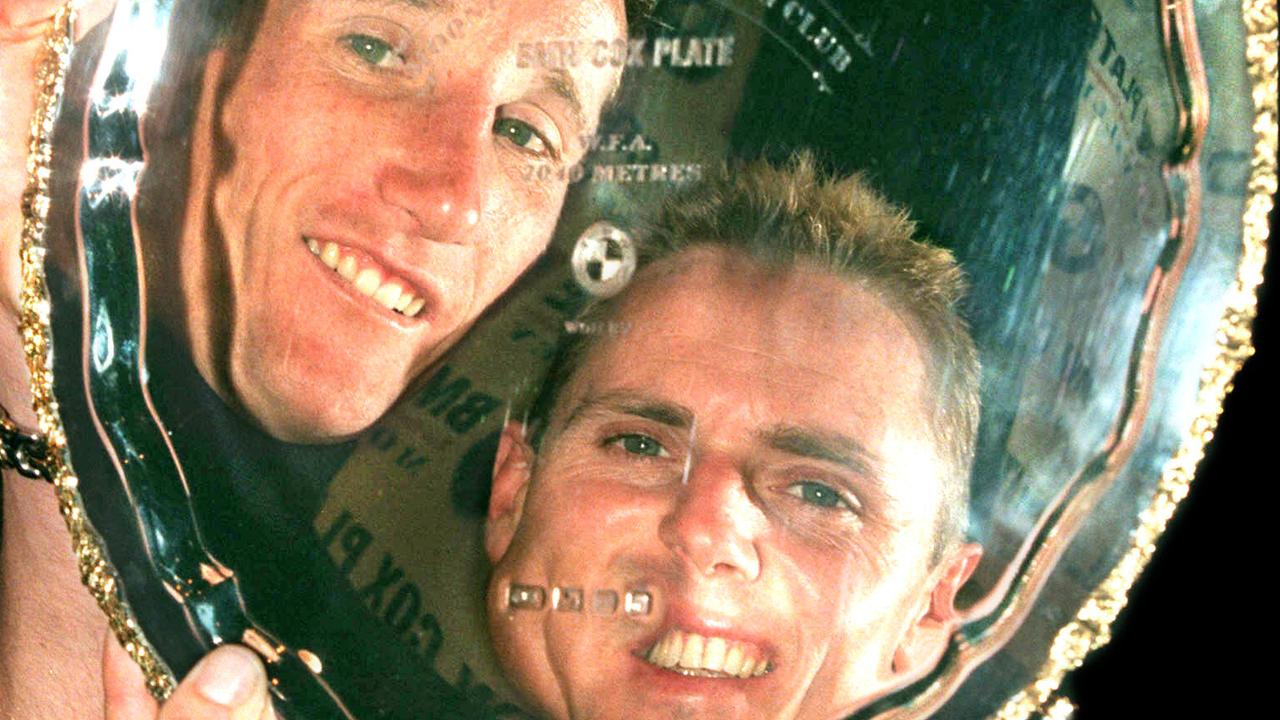 Reflection in Cox Plate trophy of jockey Damien Oliver with Shane Dye 22 Oct 1999.