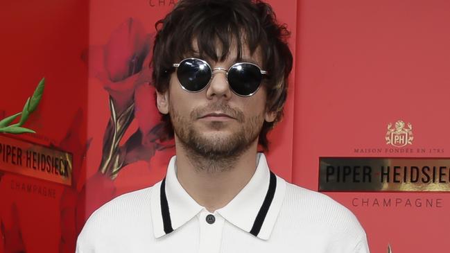 Louis Tomlinson has hit back at rumours that were spread about his alleged romance with Harry Styles. Photo by Sam Tabone/Getty Images.