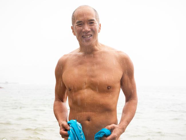 Dr Charlie Teo joined the swimmers in the rain. Picture: Jordan Shields