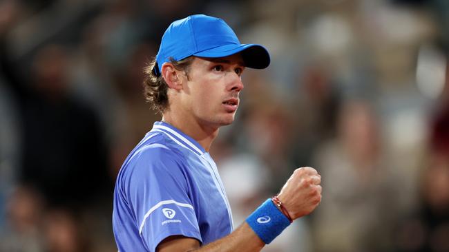 PARIS, FRANCE - JUNE 05: Alex De Minaur of Australia celebrates a point against Alexander Zverev of Germany during the Men's Singles Quarter Final match on Day 11 at Roland Garros on June 05, 2024 in Paris, France. (Photo by Clive Brunskill/Getty Images)