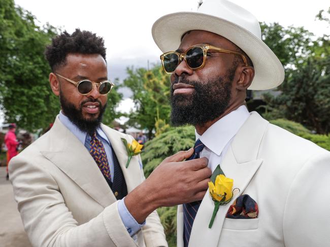 LOOKING SMART: Nash Kwari and Michael Bamigbola add some last-minute touches before entering the best suited award. Picture: David Caird