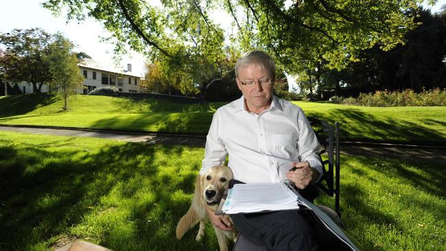 Then Prime Minister Kevin Rudd reads over notes in the garden of The Lodge with family dog Abby. Picture: Lannon Harley