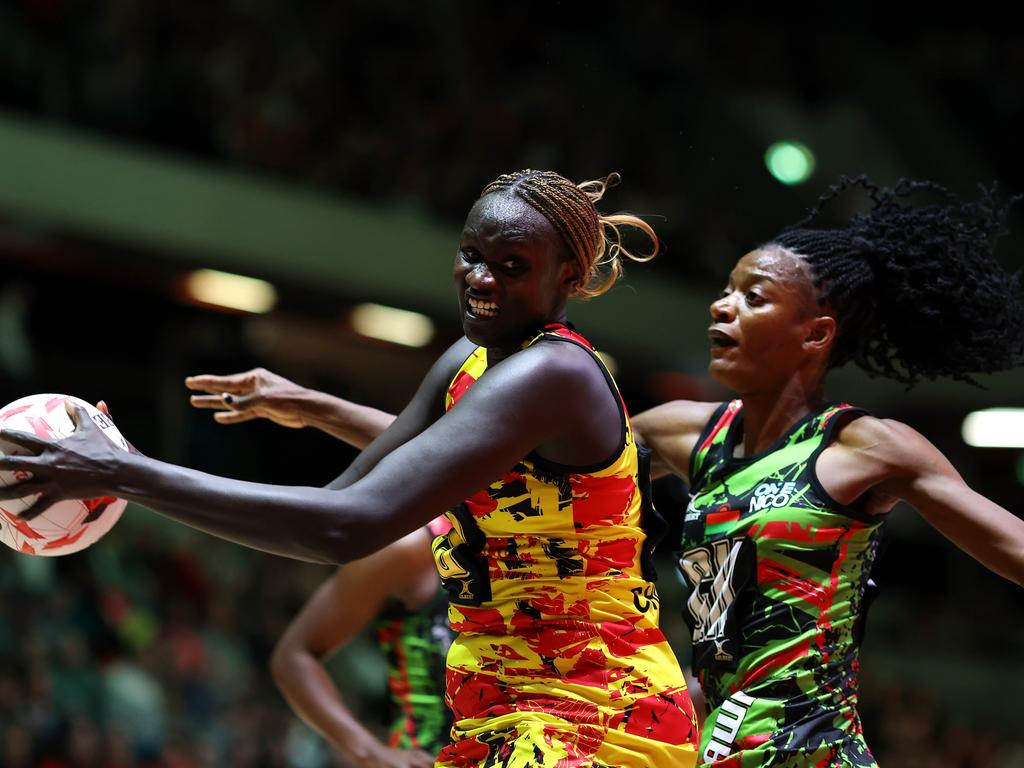 LONDON, ENGLAND - FEBRUARY 09: Mary Nuba Cholhok of Uganda beats Malawi's Tendai Masamba to the ball during Vitality Netball Nations Cup Third Place Play-off match between Malawi and Uganda at Copper Box Arena on February 09, 2025 in London, England. (Photo by Charlie Crowhurst/Getty Images for England Netball)