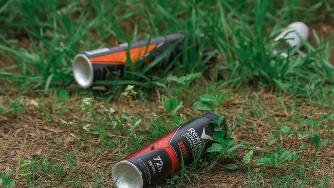 Multiple aerosol cans litter Karama park. Picture: Glenn Campbell