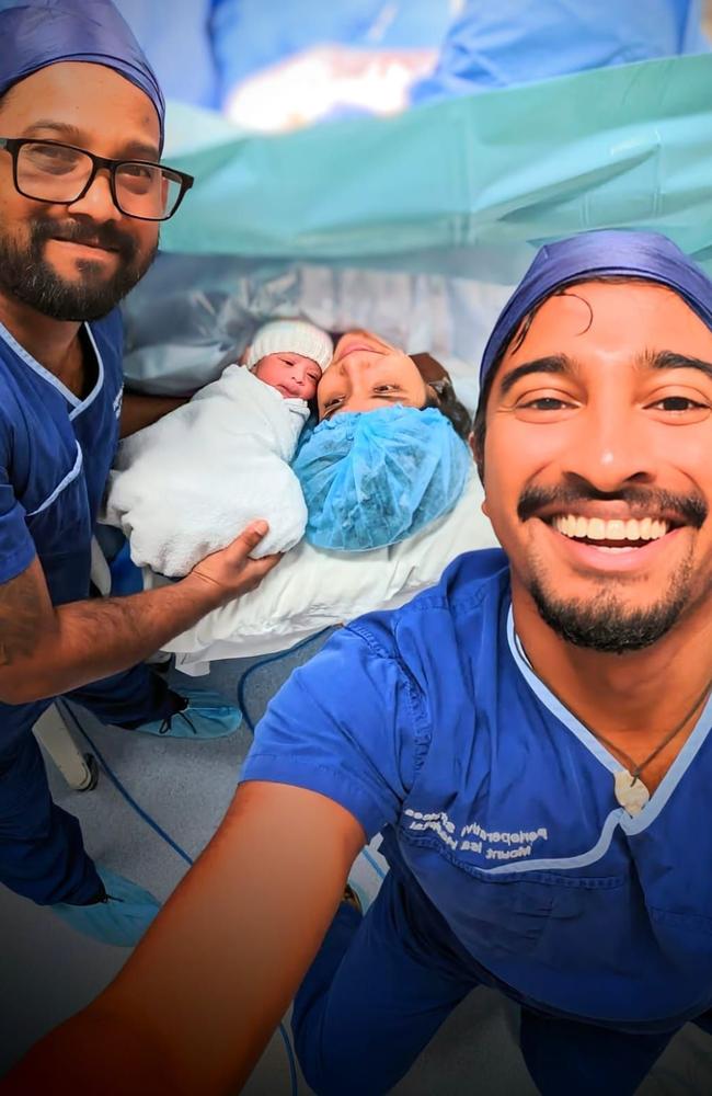 Mt Isa Hospital junior doctor Vid with his brother Rukshan, who's also a doctor, holding his newborn son Alarn and wife Noni. Picture: North West Hospital and Health Service