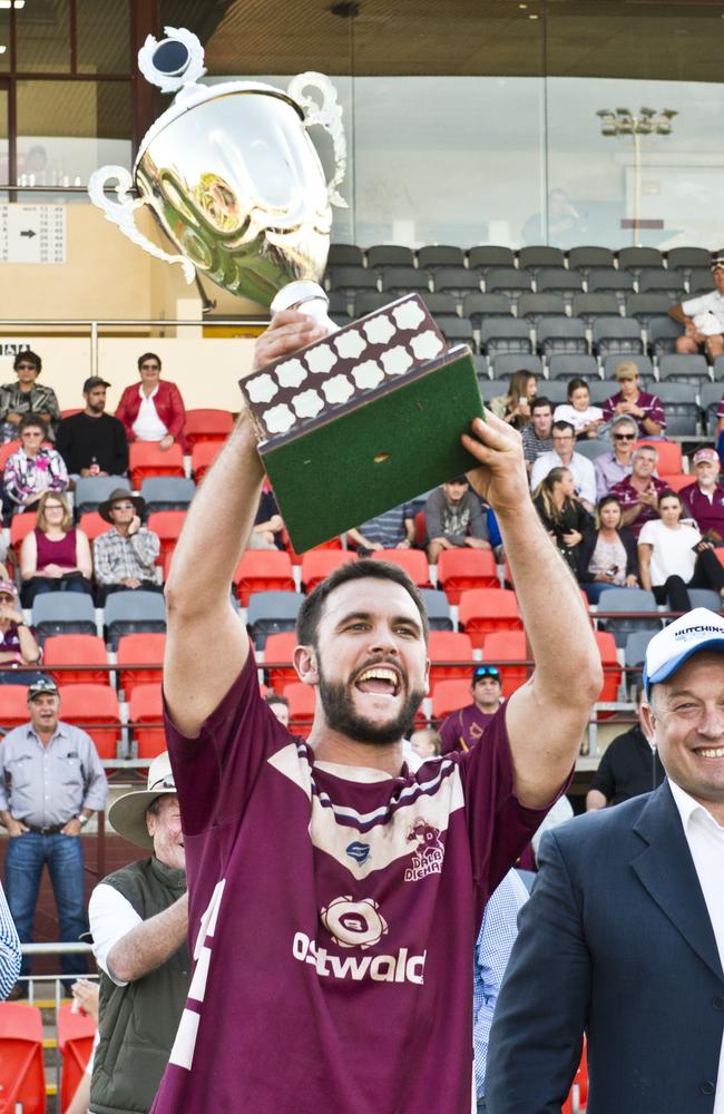 Dalby captain Colin Green celebrates the win with Nick Barker from Hutchinson Builders. TRL Grand Final, Dalby vs Pittsworth. Sunday, 3rd, Sep, 2017.