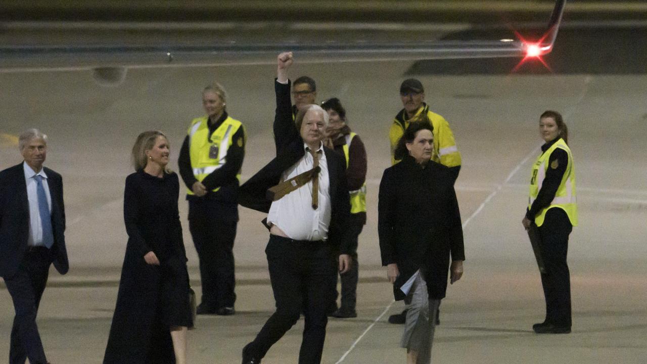 He raised a fist to his supporters when he arrived. Picture: NewsWire / Martin Ollman