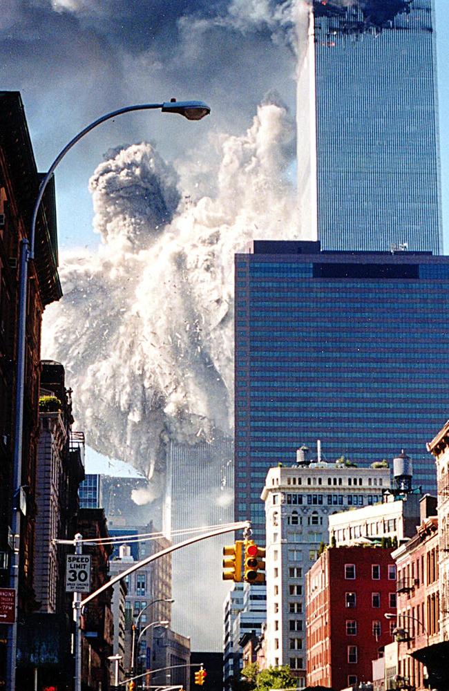 The south tower of the World Trade Center collapsing, sending dust and smoke into the streets in New York. Picture: Aaron Milestone