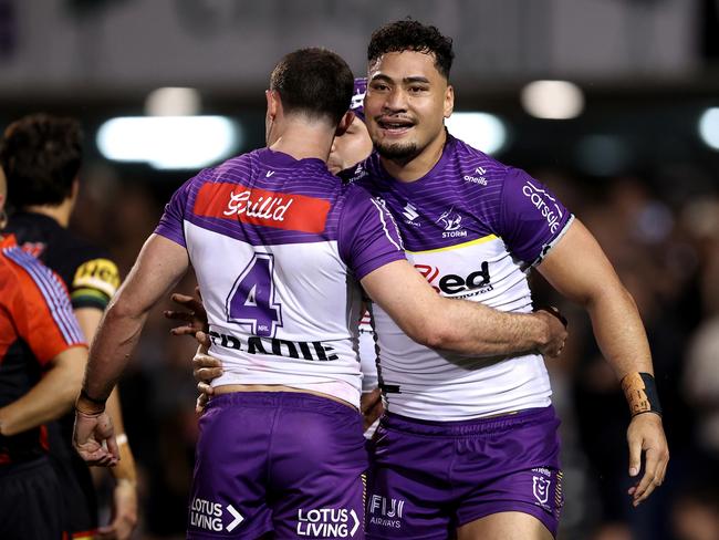 PENRITH, AUSTRALIA - AUGUST 15: Eliesa Katoa of the Panthers celebrates with team mate Nick Meaney after scoring a try during the round 24 NRL match between Penrith Panthers and Melbourne Storm at BlueBet Stadium, on August 15, 2024, in Penrith, Australia. (Photo by Brendon Thorne/Getty Images)