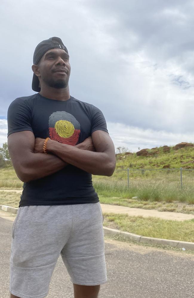 Jamie Fejo stands outside a house at the Ilpeye Ilpeye town camp on the edge of Alice Springs. Picture: Matt Cunningham