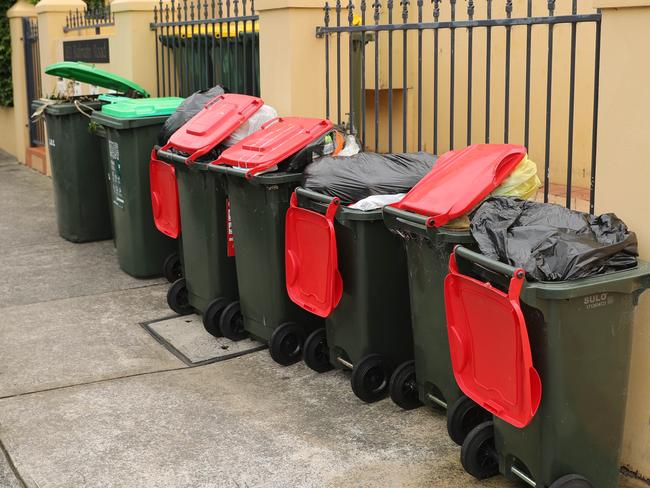 Full garbage bins, overloaded with rubbish on Hill and Balmain road in Leichhardt. The changes to collection have meant bins are always full. Picture Rohan Kelly.