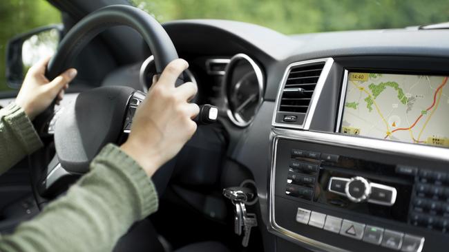 Cropped shot of a woman driving a car with a gps system. Supplied: iStock