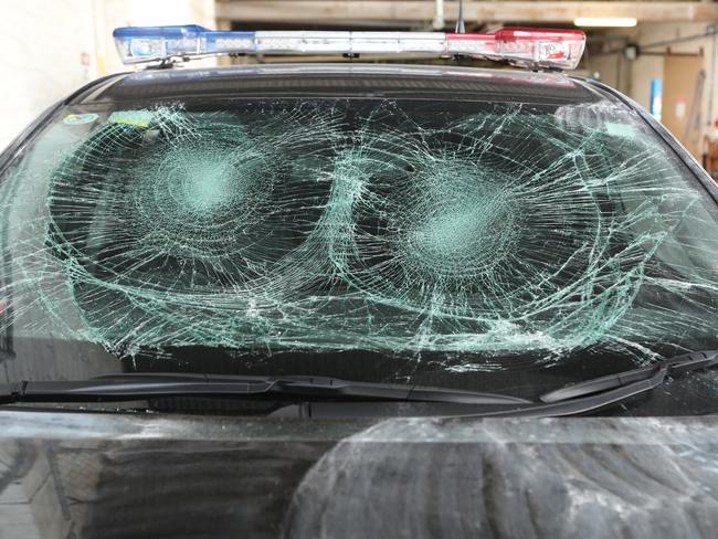 The damage to one of the police cars. Picture: David Crosling