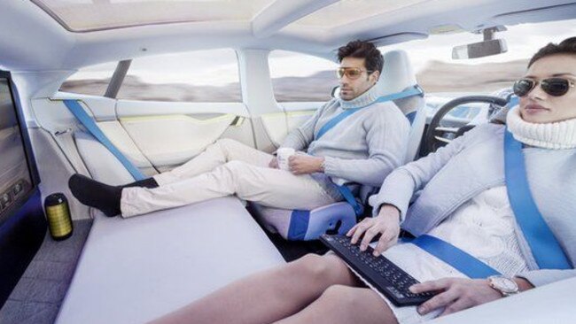 Zachary and his girlfriend chilling in their driverless car.