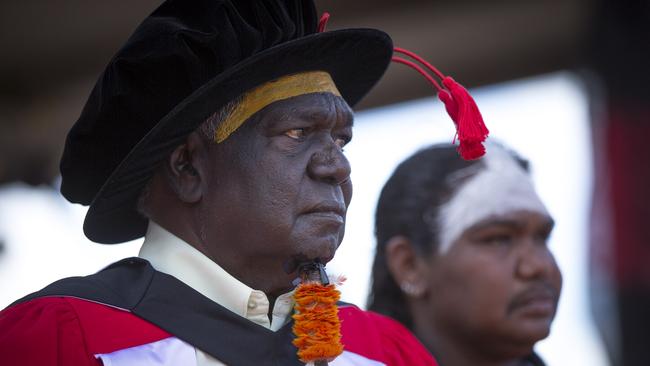 Yunupingu is Invested with an honorary Doctor of Laws by the University of Melbourne at Garma in 2015. Picture: Peter Eve / Yothu Yindi Foundation