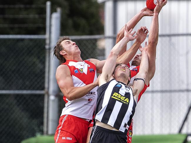 TSL, Glenorchy Cameron Goodsell and Clarence Keegan Wylie and Zac Buechner contest a mark at KGV Oval. Picture: Chris Kidd