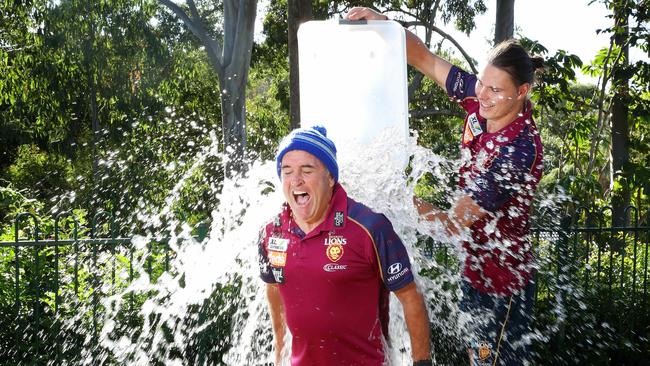 Chris Fagan doing the ice bucket challenge, with Lion Eric Hipwood doing the honours. Picture: Liam Kidston