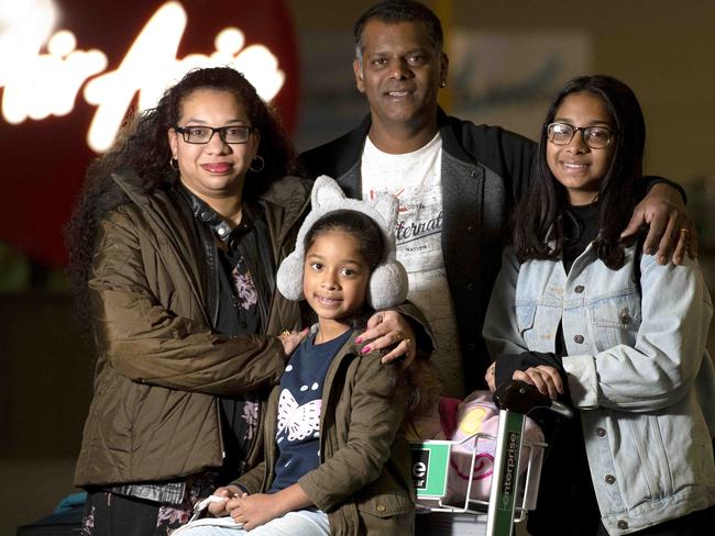 Trish and Vick Doolar with children Isha, 16, and Keisha, 7, at Avalon Airport terminal. Picture: Naomi Jellicoe