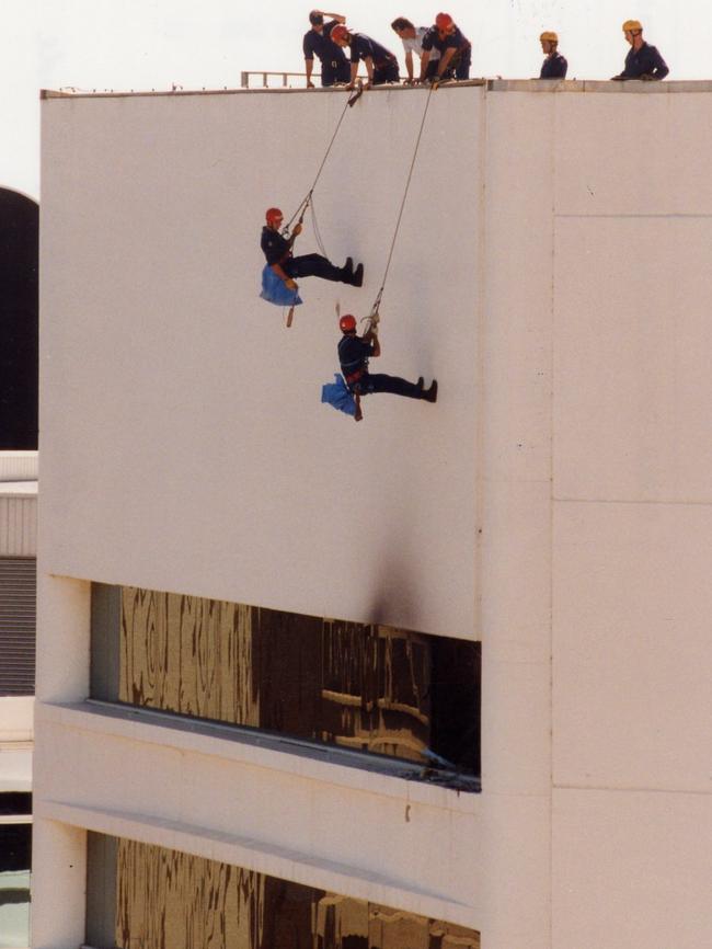 Star Force officers checking the bombed NCA Building in 1994.