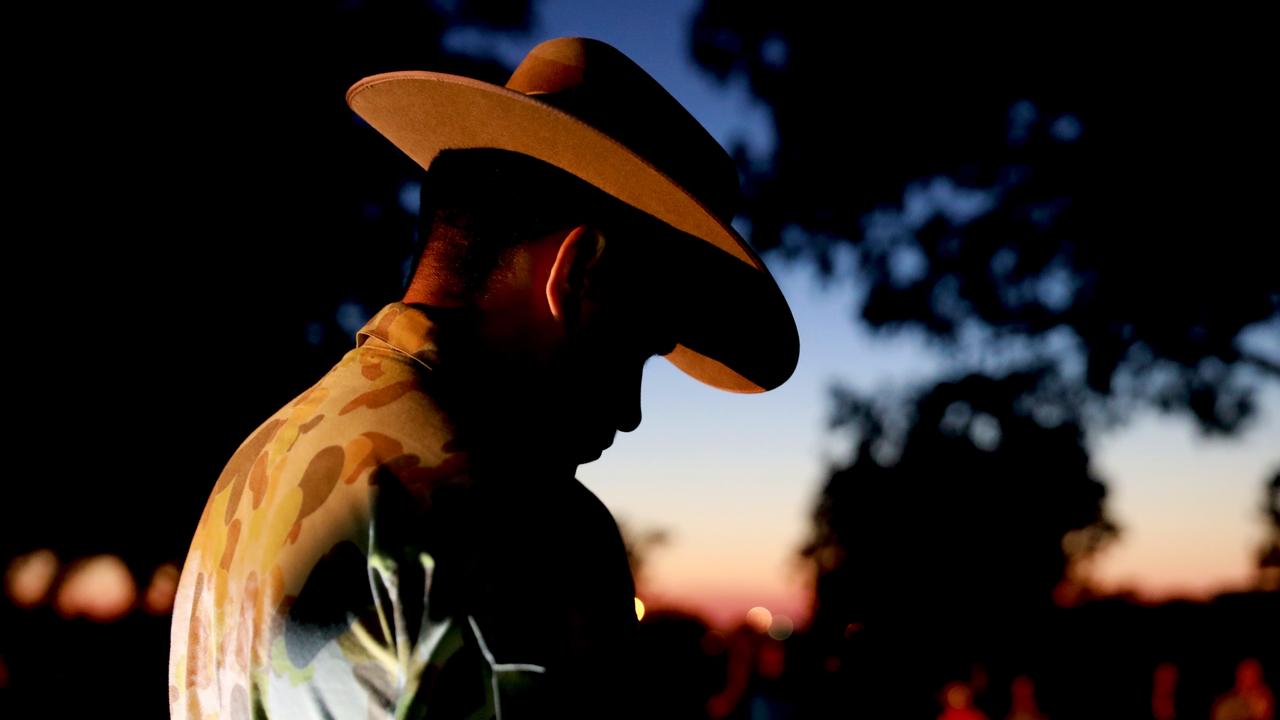 A member of the Blacktown 202 Army Cadet Unit bows his head for a minute’s silence during Pinegrove Memorial Park’s Anzac Day dawn service at Minchinbury. Picture: Angelo Velardo