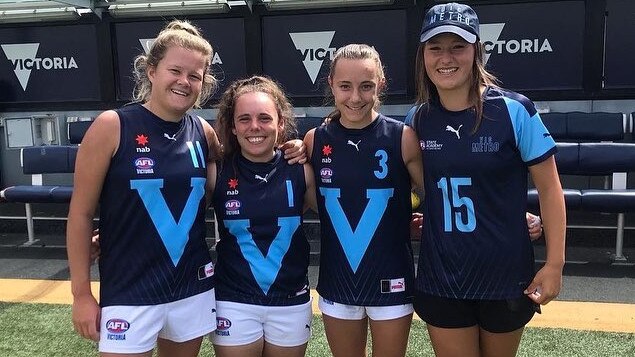 Lulu Beatty (right) with her Northern Knights Vic Metro teammates.